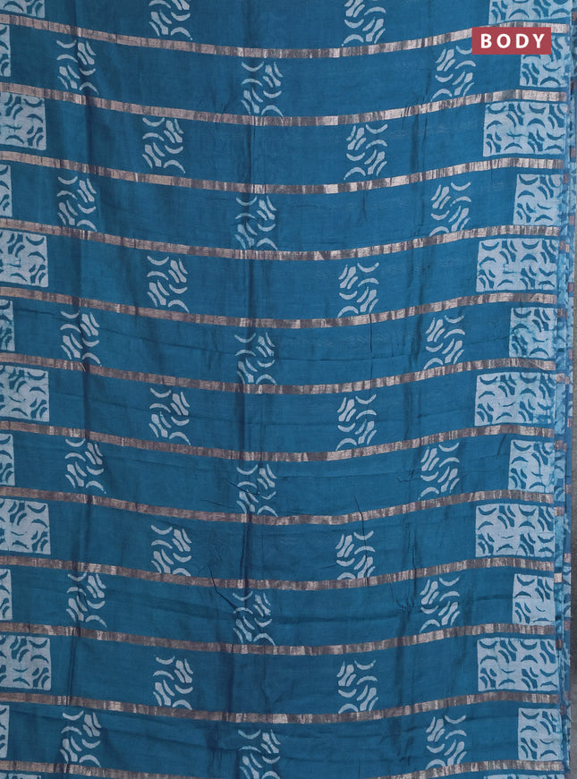 Semi chanderi saree peacock green with allover zari strips & batik butta prints in borderless style