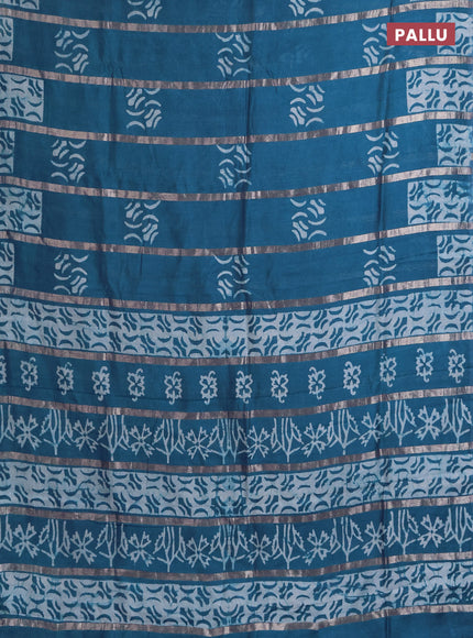 Semi chanderi saree peacock green with allover zari strips & batik butta prints in borderless style