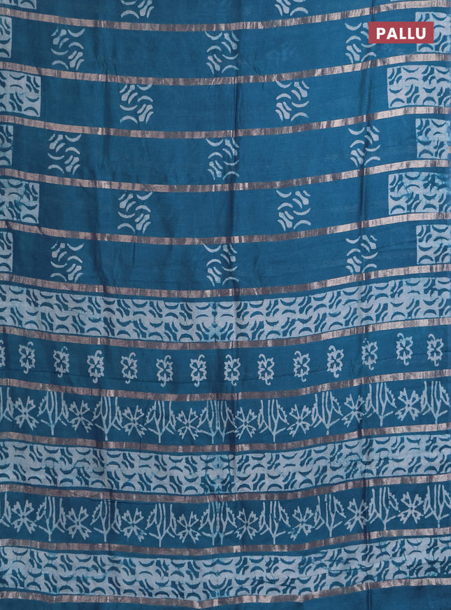 Semi chanderi saree peacock green with allover zari strips & batik butta prints in borderless style