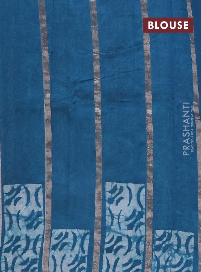 Semi chanderi saree peacock green with allover zari strips & batik butta prints in borderless style