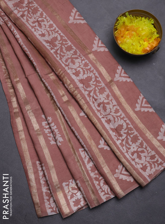 Semi chanderi saree pastel brown with allover zari strips & batik butta prints in borderless style