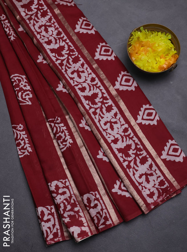 Semi chanderi saree maroon with allover zari strips & batik butta prints in borderless style