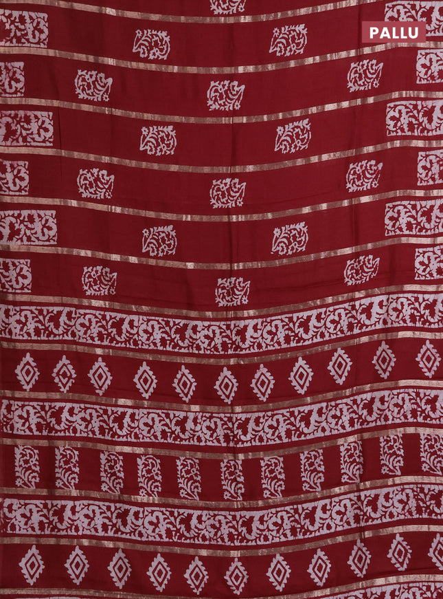 Semi chanderi saree maroon with allover zari strips & batik butta prints in borderless style