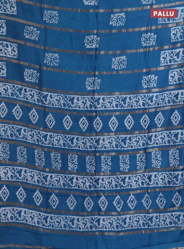 Semi chanderi saree peacock blue with allover zari strips & batik butta prints in borderless style