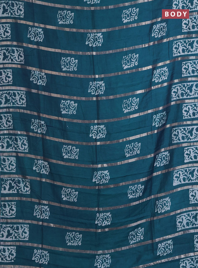 Semi chanderi saree peacock green with allover zari strips & batik butta prints in borderless style