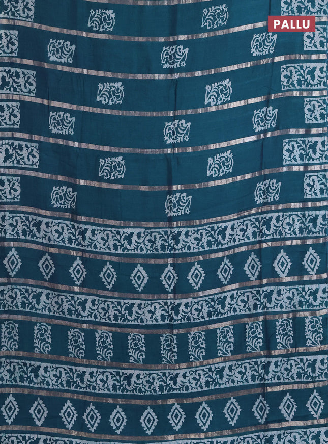 Semi chanderi saree peacock green with allover zari strips & batik butta prints in borderless style