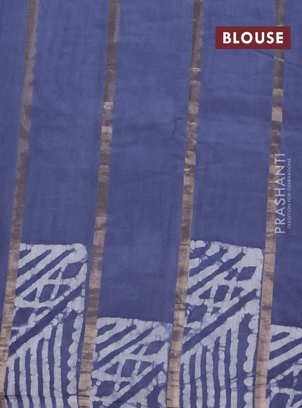Semi chanderi saree dark grey with allover zari strips & batik butta prints in borderless style