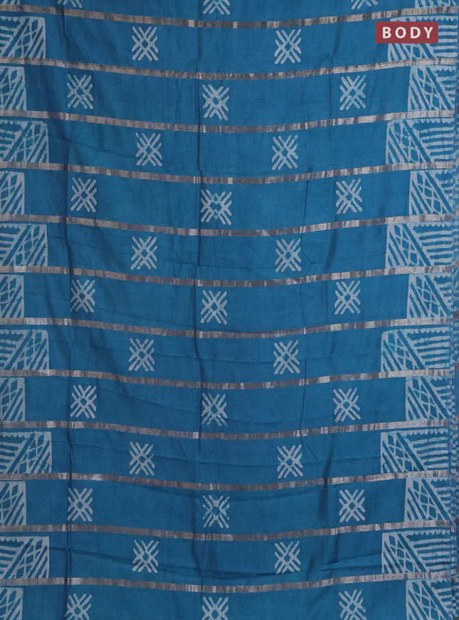 Semi chanderi saree cs blue with allover zari strips & batik butta prints in borderless style