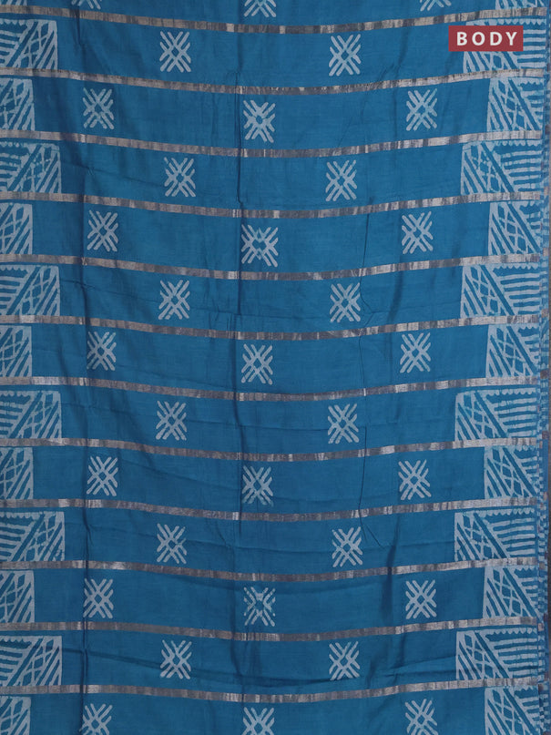 Semi chanderi saree cs blue with allover zari strips & batik butta prints in borderless style