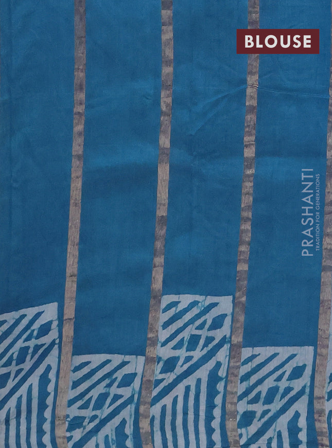 Semi chanderi saree cs blue with allover zari strips & batik butta prints in borderless style