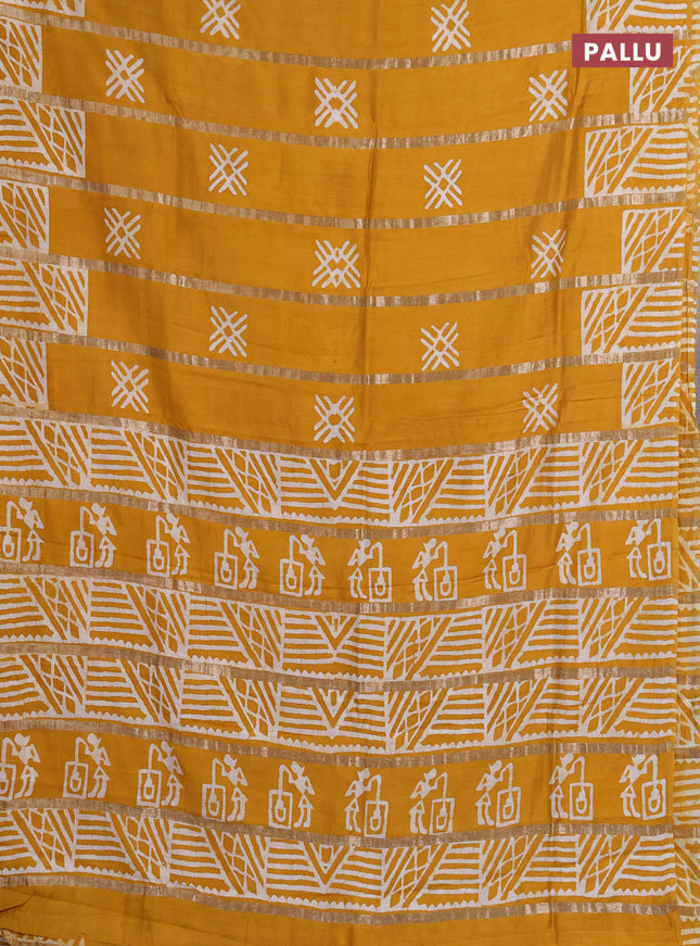 Semi chanderi saree mustard yellow with allover zari strips & batik butta prints in borderless style