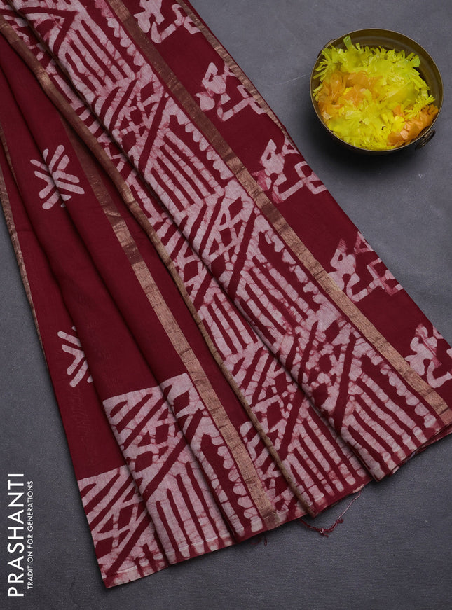 Semi chanderi saree maroon with allover zari strips & batik butta prints in borderless style
