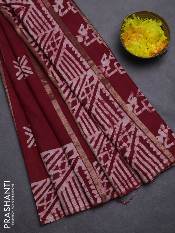 Semi chanderi saree maroon with allover zari strips & batik butta prints in borderless style