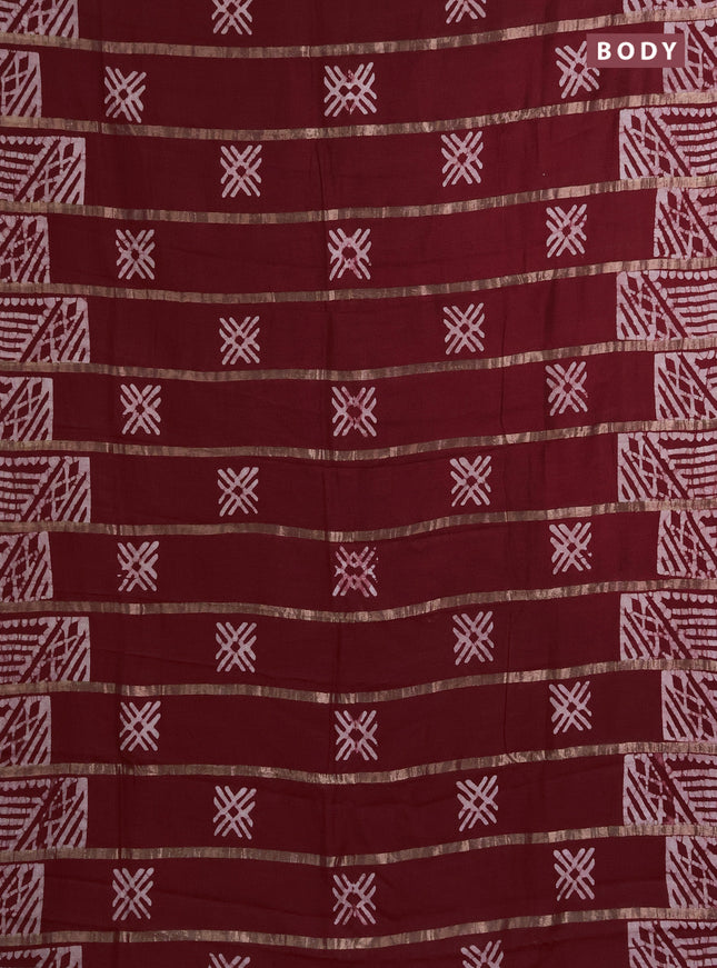 Semi chanderi saree maroon with allover zari strips & batik butta prints in borderless style