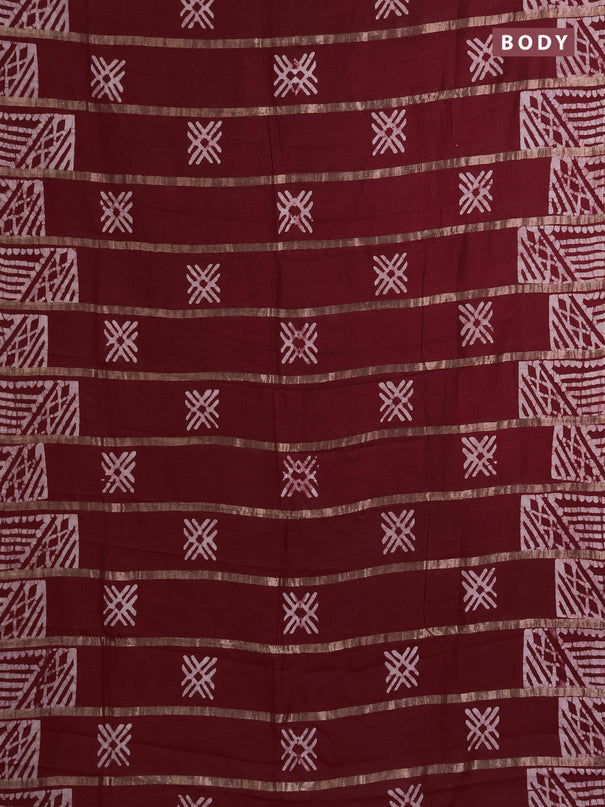 Semi chanderi saree maroon with allover zari strips & batik butta prints in borderless style
