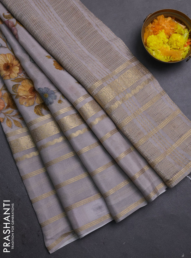 Semi georgette saree grey with allover floral prints and long zari woven border