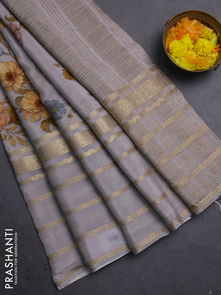 Semi georgette saree grey with allover floral prints and long zari woven border