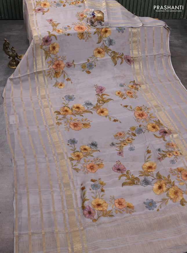 Semi georgette saree grey with allover floral prints and long zari woven border
