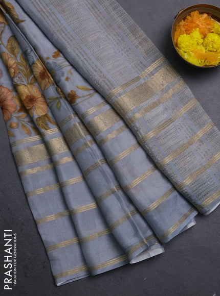 Semi georgette saree grey with allover floral prints and long zari woven border