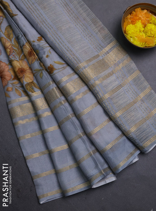 Semi georgette saree grey with allover floral prints and long zari woven border