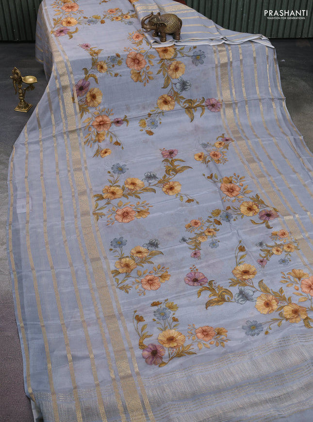 Semi georgette saree grey with allover floral prints and long zari woven border