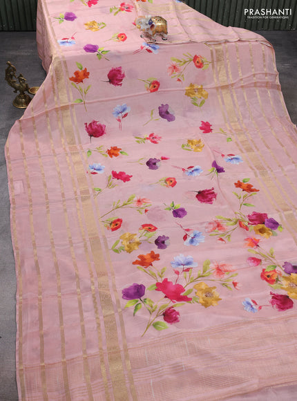 Semi georgette saree peach shade with allover floral prints and long zari woven border
