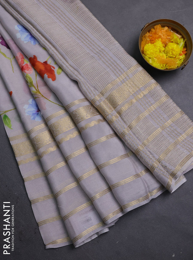 Semi georgette saree grey with allover floral prints and long zari woven border