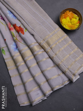 Semi georgette saree grey with allover floral prints and long zari woven border