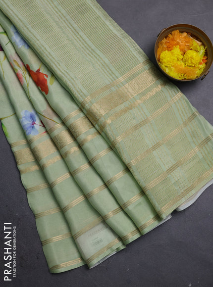 Semi georgette saree pastel green with allover floral prints and long zari woven border