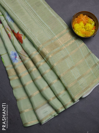 Semi georgette saree pastel green with allover floral prints and long zari woven border