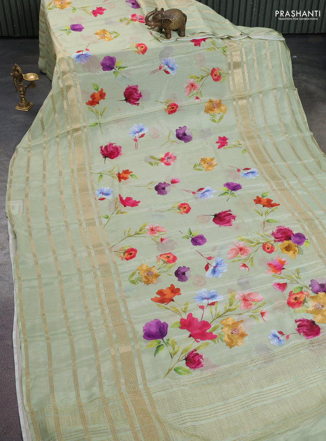 Semi georgette saree pastel green with allover floral prints and long zari woven border