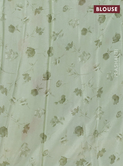 Semi georgette saree pastel green with allover floral prints and long zari woven border