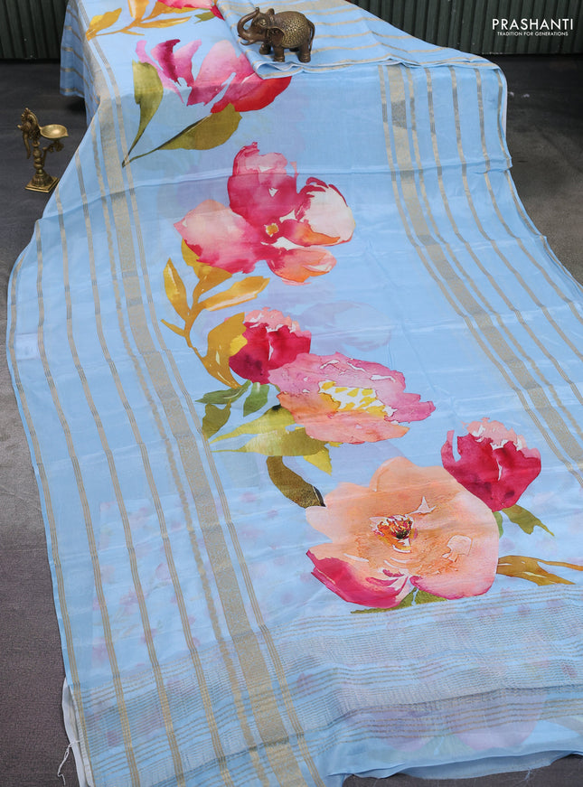 Semi georgette saree blue shade with allover floral prints and long zari woven border