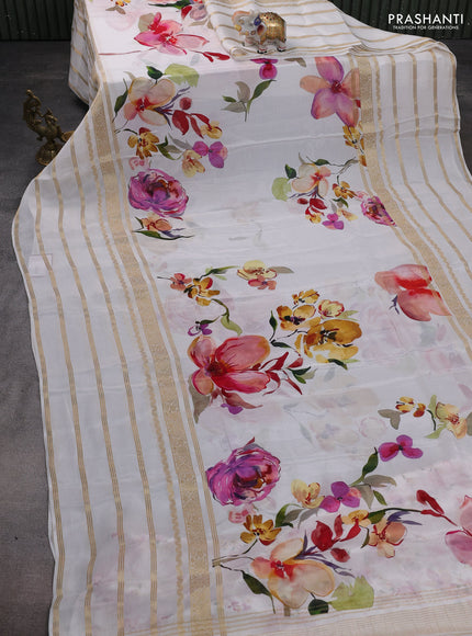 Semi georgette saree off white with allover floral prints and long zari woven border
