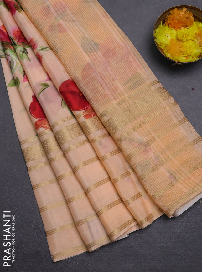 Semi georgette saree pale orange with allover floral prints and long zari woven border