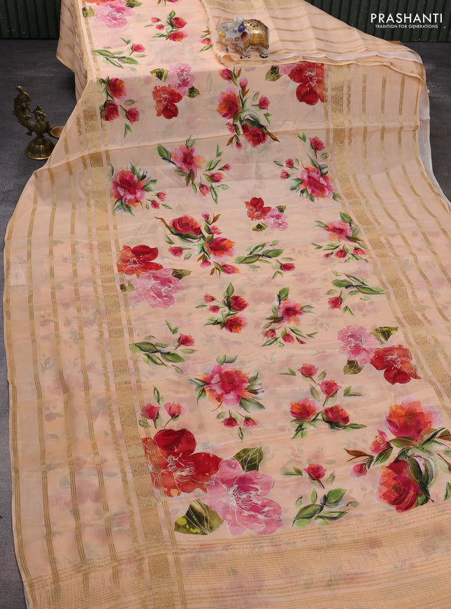 Semi georgette saree pale orange with allover floral prints and long zari woven border