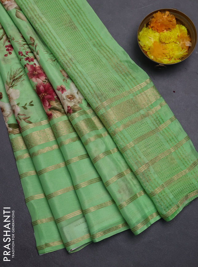 Semi georgette saree green with allover floral prints and long zari woven border
