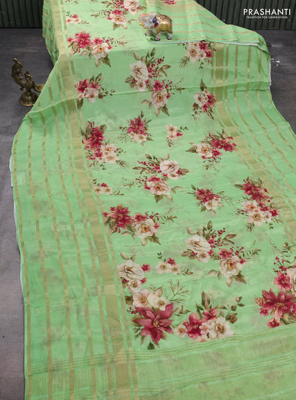 Semi georgette saree green with allover floral prints and long zari woven border