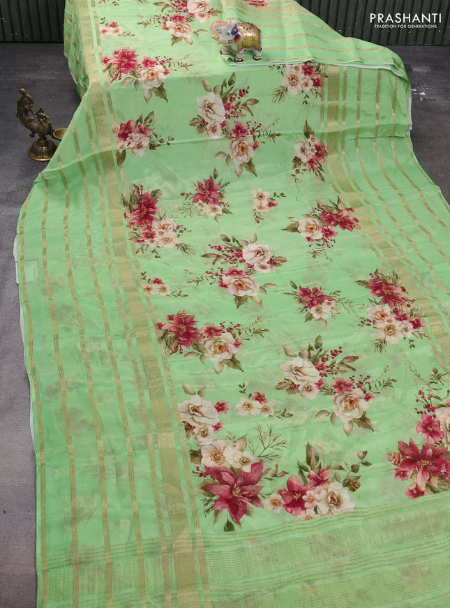 Semi georgette saree green with allover floral prints and long zari woven border