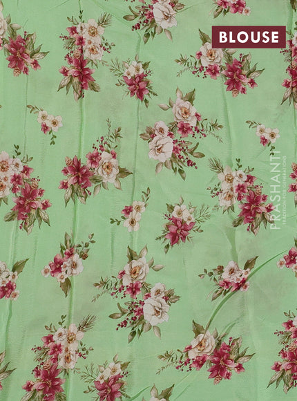 Semi georgette saree green with allover floral prints and long zari woven border