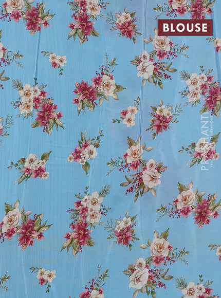 Semi georgette saree blue shade with allover floral prints and long zari woven border