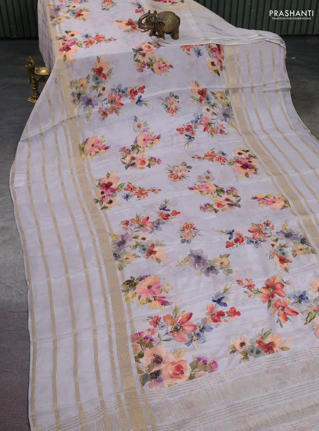 Semi georgette saree pastel grey with allover floral prints and long zari woven border