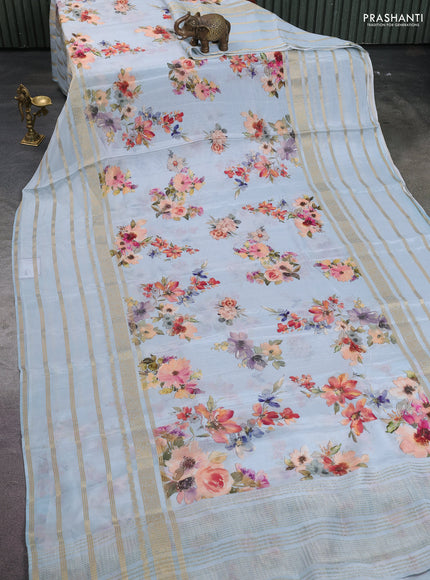 Semi georgette saree pastel blue with allover floral prints and long zari woven border