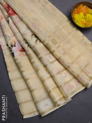 Semi georgette saree pale yellow with allover floral prints and long zari woven border
