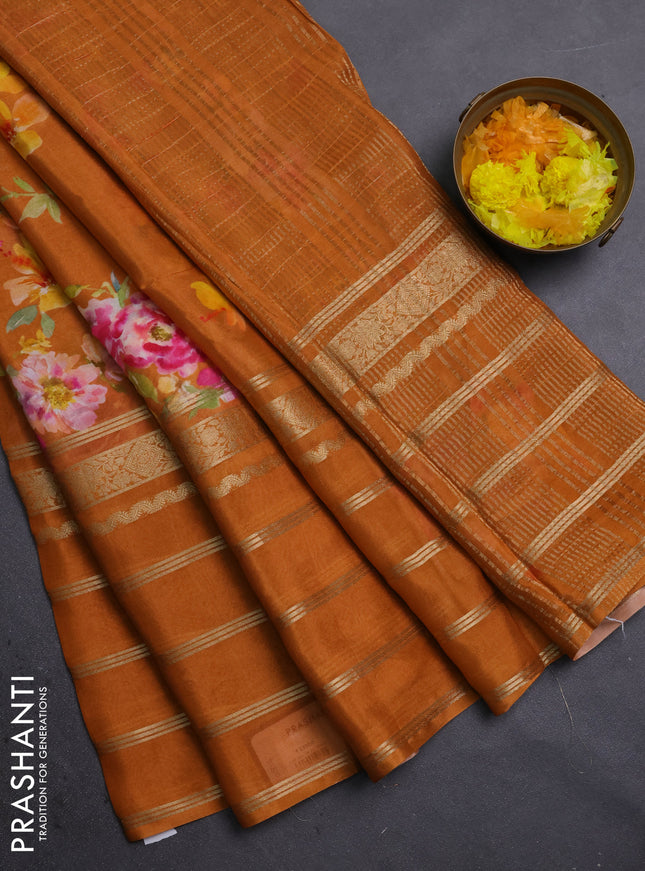 Semi georgette saree rustic orange with allover floral prints and long zari woven border