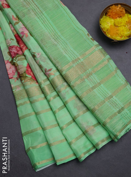 Semi georgette saree green with allover floral prints and long zari woven border