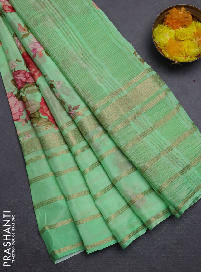 Semi georgette saree green with allover floral prints and long zari woven border