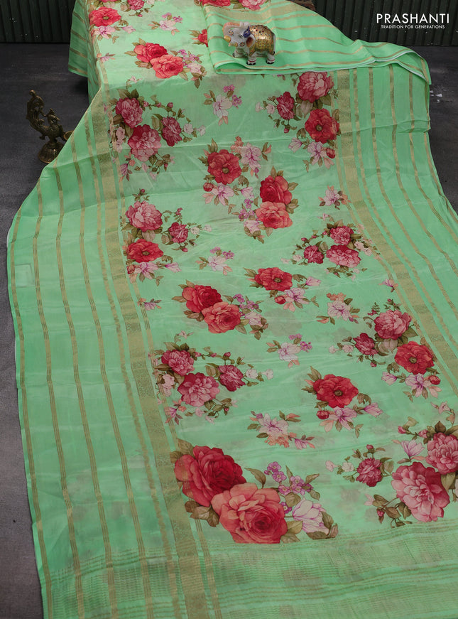 Semi georgette saree green with allover floral prints and long zari woven border