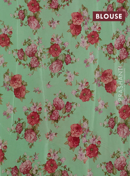 Semi georgette saree green with allover floral prints and long zari woven border