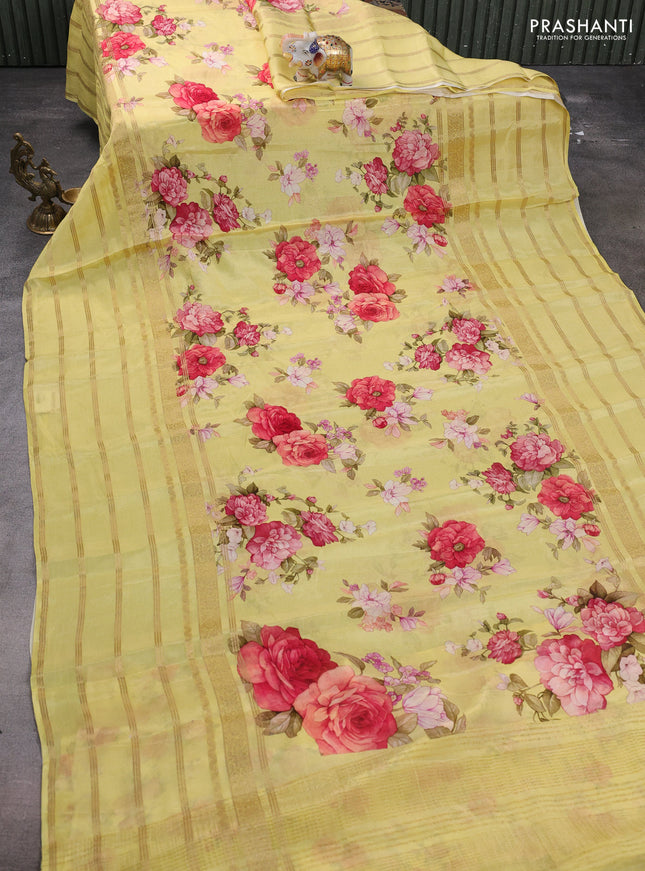 Semi georgette saree yellow with allover floral prints and long zari woven border
